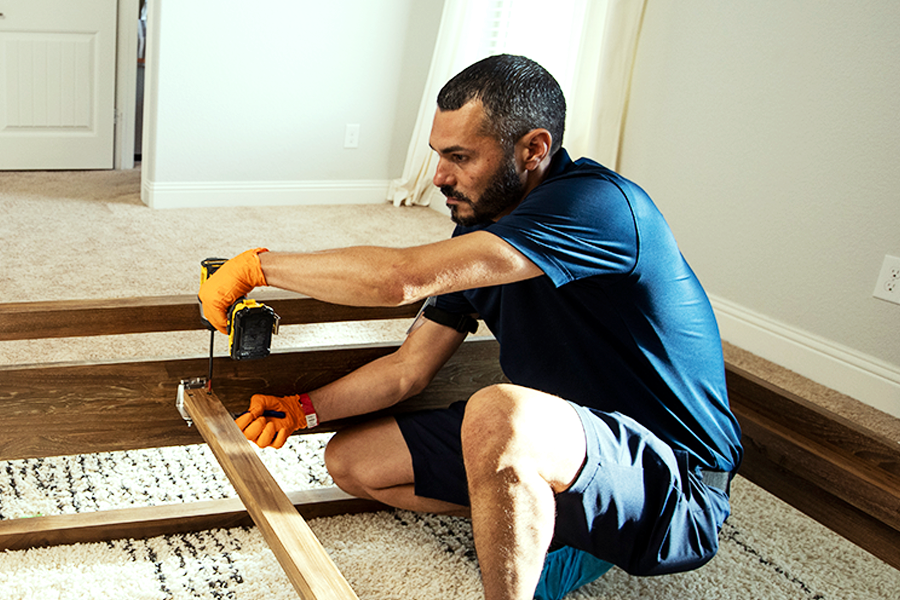 Ryder last mile delivery staff installing furniture for customer